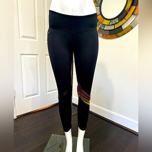 AVIATOR NATION black 3/4 length leggings with yellow, red, purple stripes @ knee